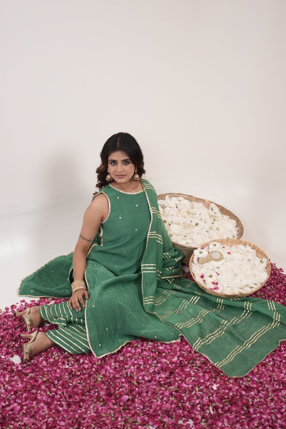 Resham Royal Green suit set — seated editorial view